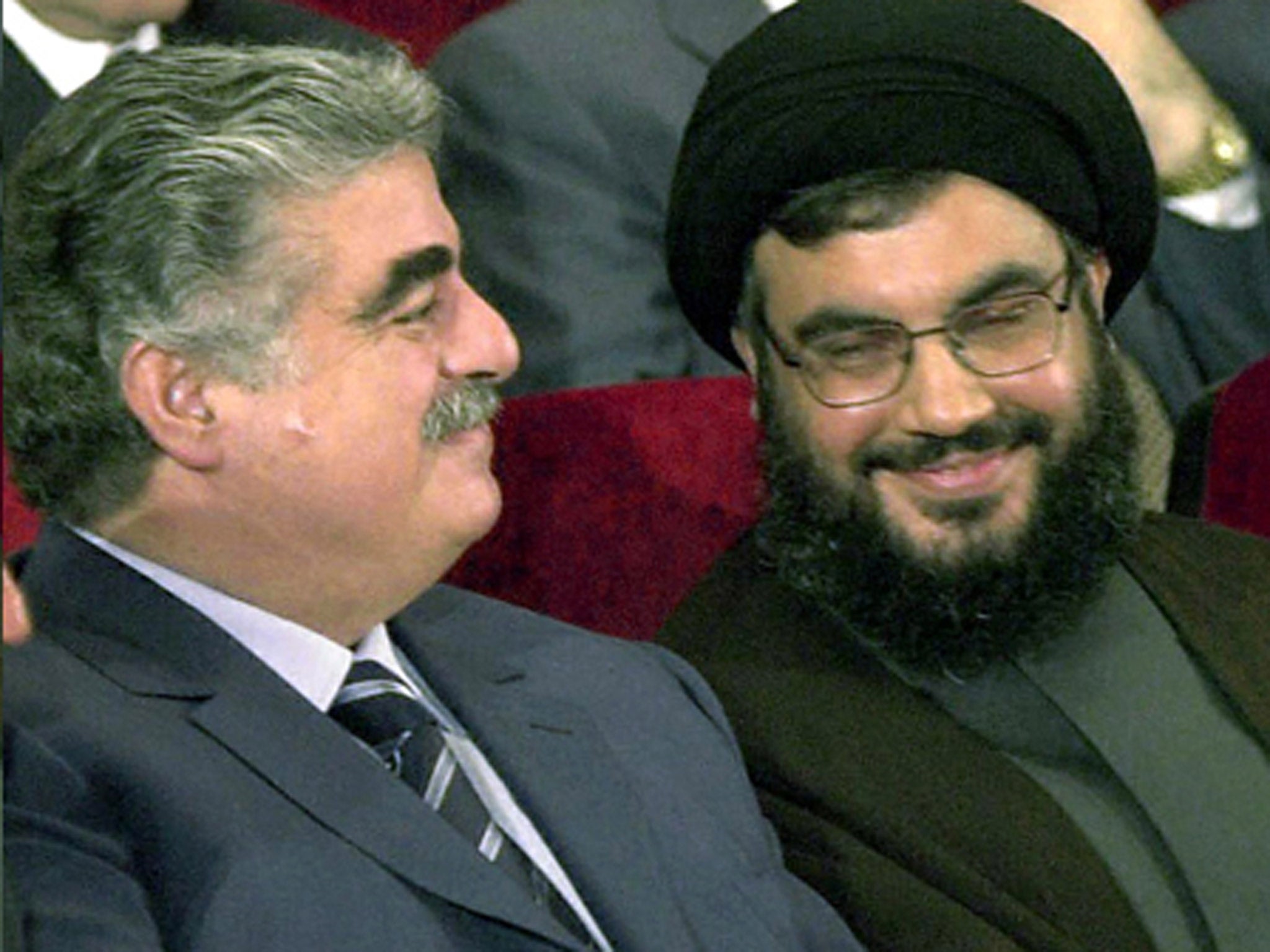 Lebanese Prime Minister Rafiq Hariri (left) in 2001 with Hassan Nasrallah, general secretary of Hezbollah, which is suspected of his murder