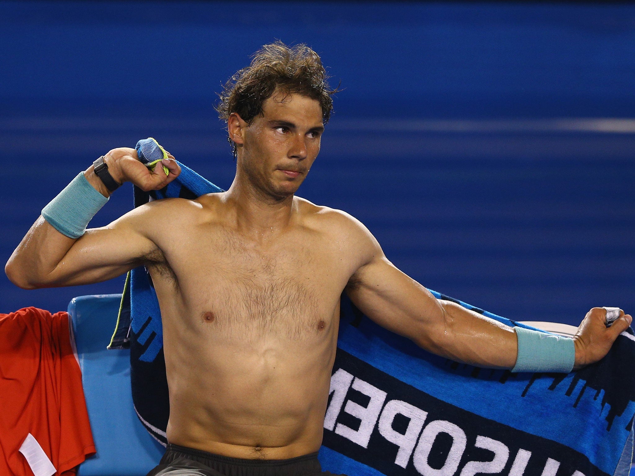 Rafael Nadal tries to cool himself down while on court at the Australian Open