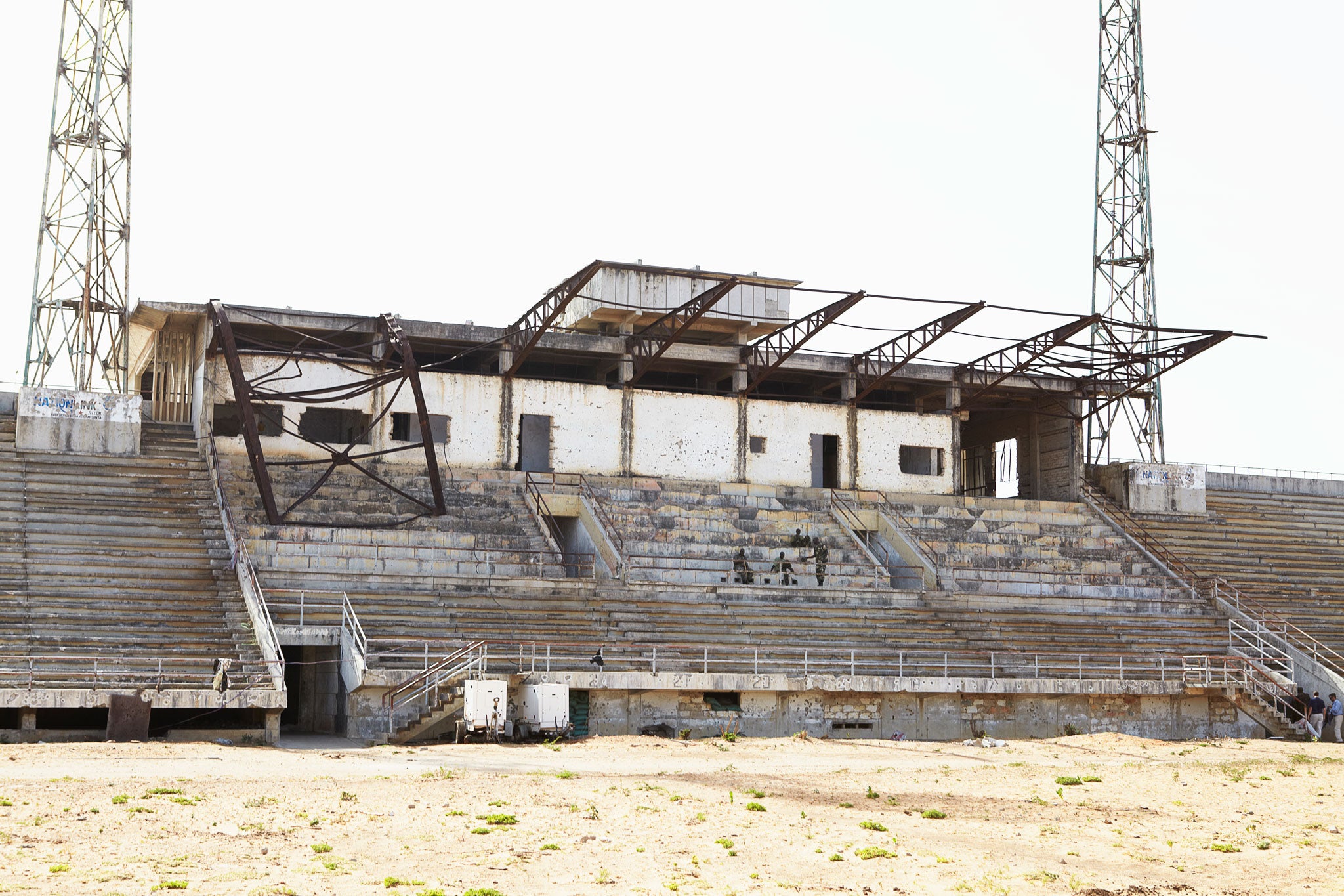 Mogadishu stadium was reduced to a shell when it became a centre for the fighting in the Somali capital. Al- Shabaab used it as a base until their men were forced out by Africa Union troops, now seen relaxing on its main stand