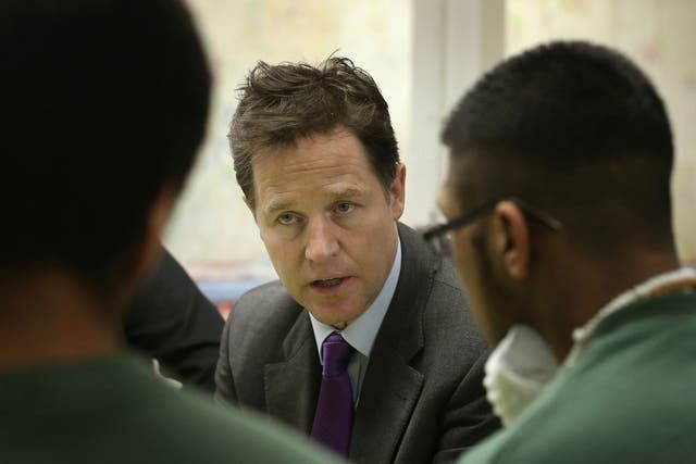 Nick Clegg speaks with inmates during a visit to the Cookham Wood Young Offenders Institution in Rochester