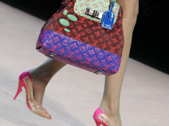 Louis Vuitton is finding that customers no longer buy handbags for the logo and is changing tack