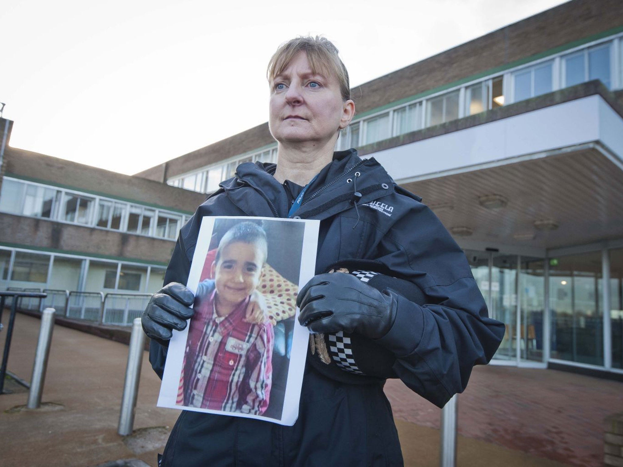 Superintendent Liz McCainsh holds a photo of missing 3-year-old boy Mikaeel Kular who was last seen going to bed at his family's flat, at around 9pm and was discovered missing from his bed by his mother at around 7.15am when the family woke up