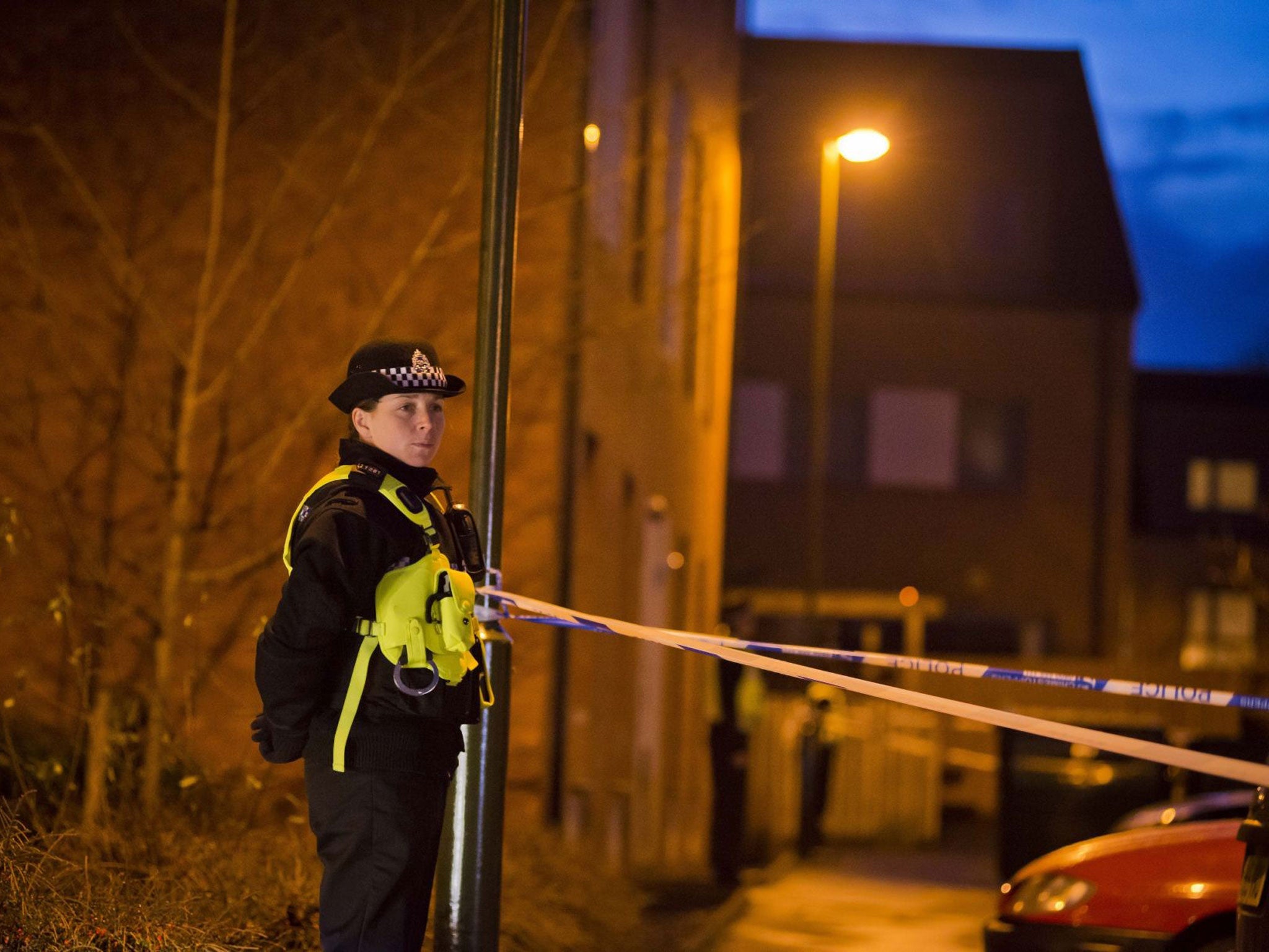 A police officer stands guard near the home of missing boy Mikaeel Kular