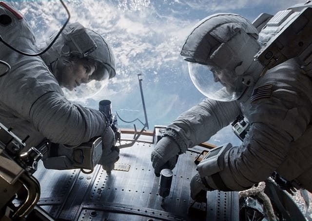 Sandra Bullock and George Clooney in Alfonso Cuaron's Gravity