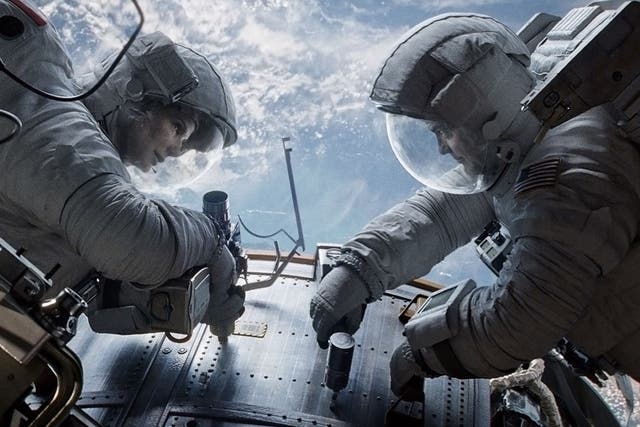 Sandra Bullock and George Clooney in Alfonso Cuaron's Gravity