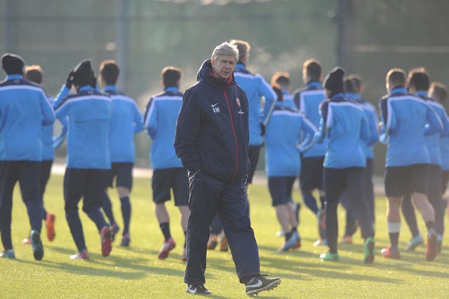 Arsene Wenger pictured taking an Arsenal training session