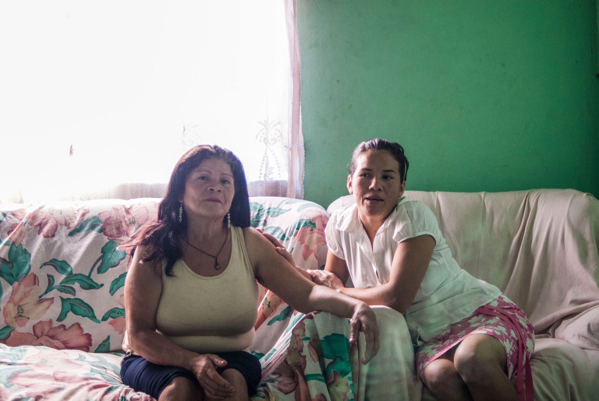 Josefina Flores, left, with her daughter Xiomara. Xiomara, now 32, was taken from Josefina when bshe was just one-anda- half, in 1984. They did not see each other again until 2 December 2013