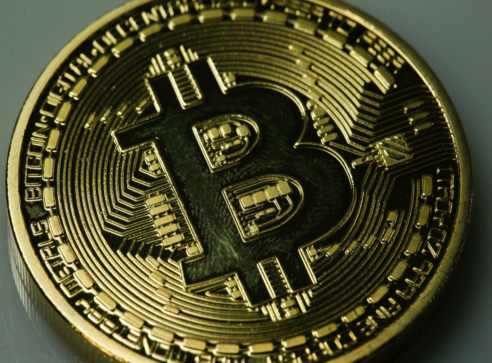 Bitcoin is a peer-to-peer currency that avoids central banking systems by letting owners set up their own transactions. The currency's value has fluctuated dramatically since its introduction.