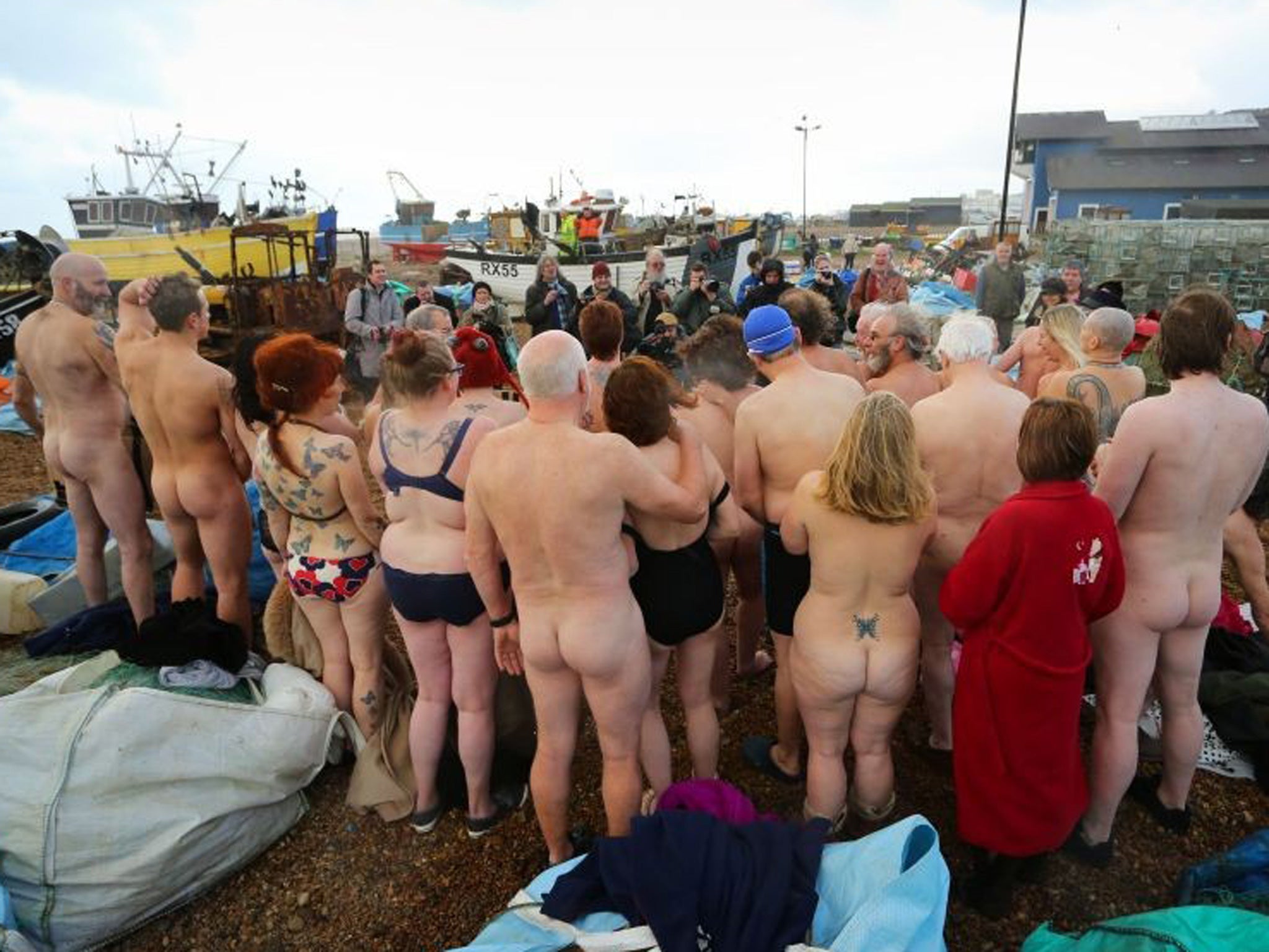 Residents of Hastings in East Sussex bare all in a naked flash mob on the beach, as the Jerwood Gallery in the town competes to win a photographic portrait session with photographer Spencer Tunick