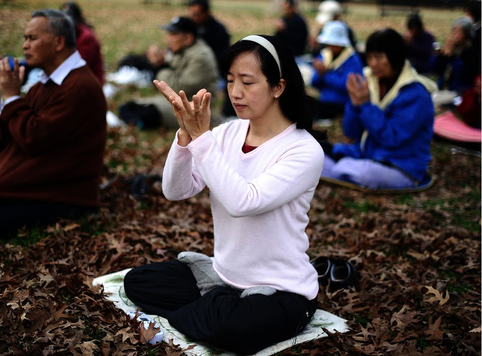 Members of Falun Gong spiritual movement meditate at the Lafayette Park. A new study has suggested that spiritual activity such as meditation may hep prevent depression by thickening the brain cortex