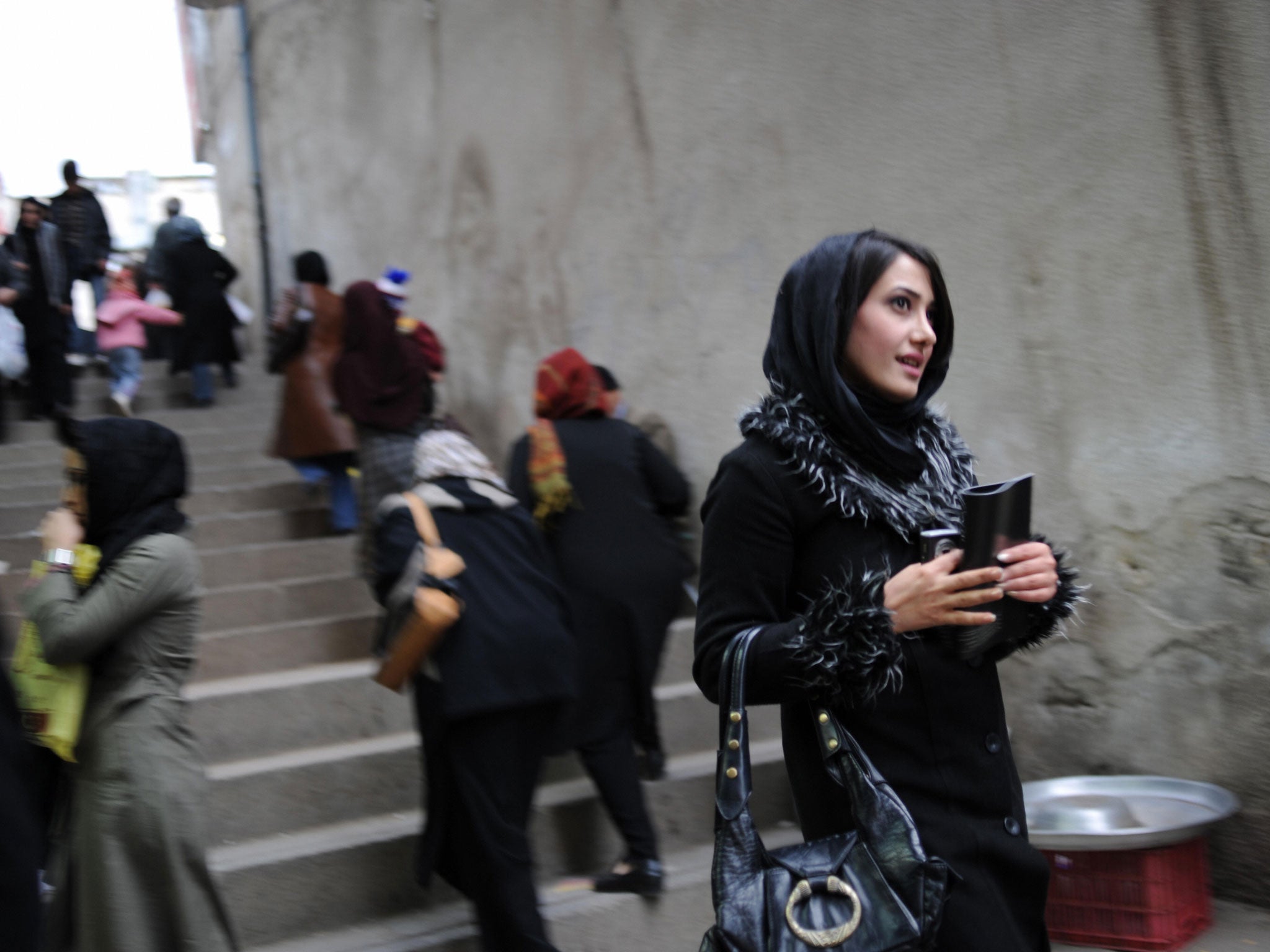 In today's relaxed Tehran, headscarves are being worn back from the face 