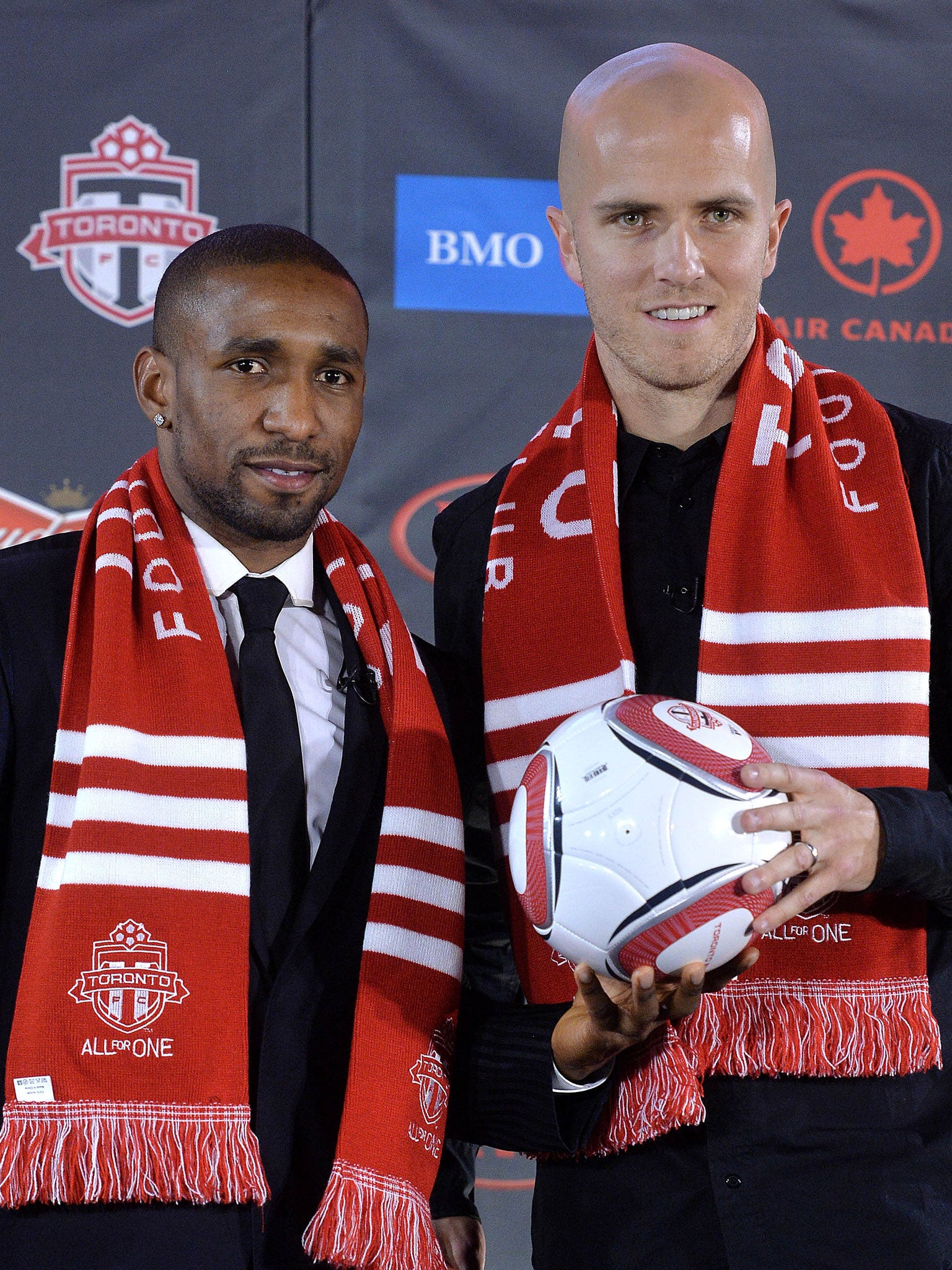 Jermain Defoe (left) and former Roma player Michael Bradley arrive in Toronto in a double deal worth more than £60m