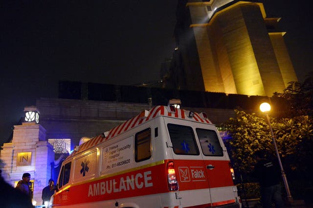 An ambulance arrives at the Leela Hotel in New Delhi where wife of Indian minister Shashi Tharoor, Sunanda Pushkar was found dead