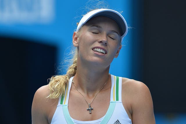 Caroline Wozniacki was knocked out of the Australian Open after losing 4-6 7-5 6-3 to young Spaniard Garbine Muguruza
