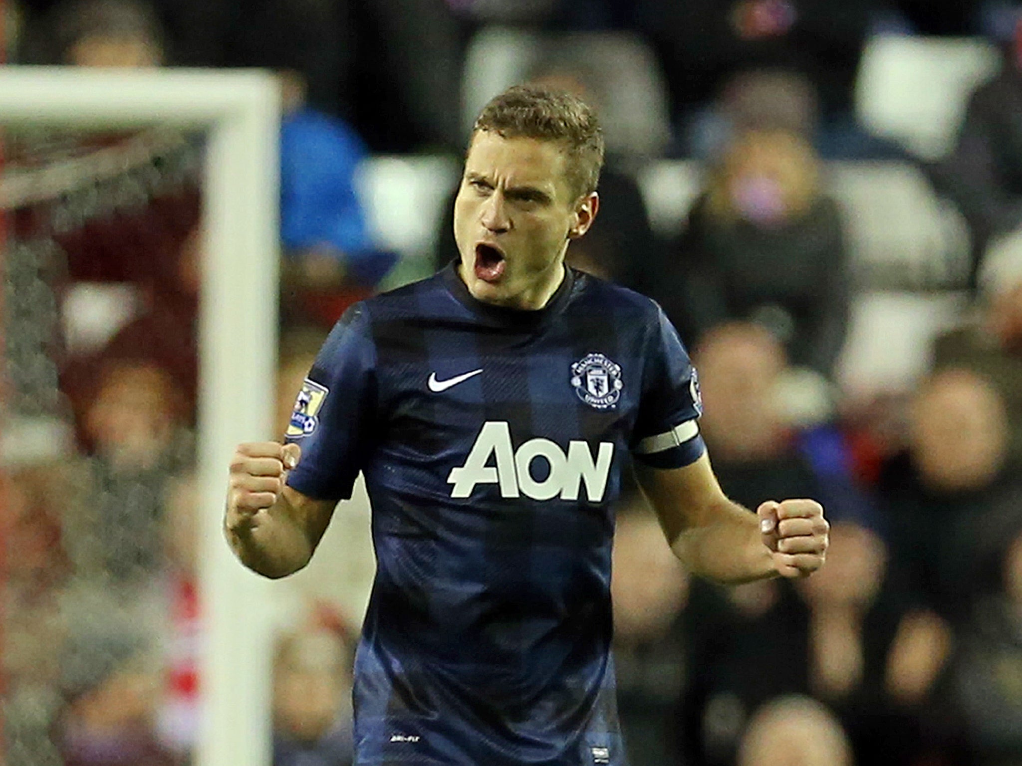 Nemanja Vidic has claimed he will not give up on Manchester United's title chances