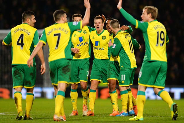 Norwich City players celebrate after Ryan Bennett scored a late winner against Hull City