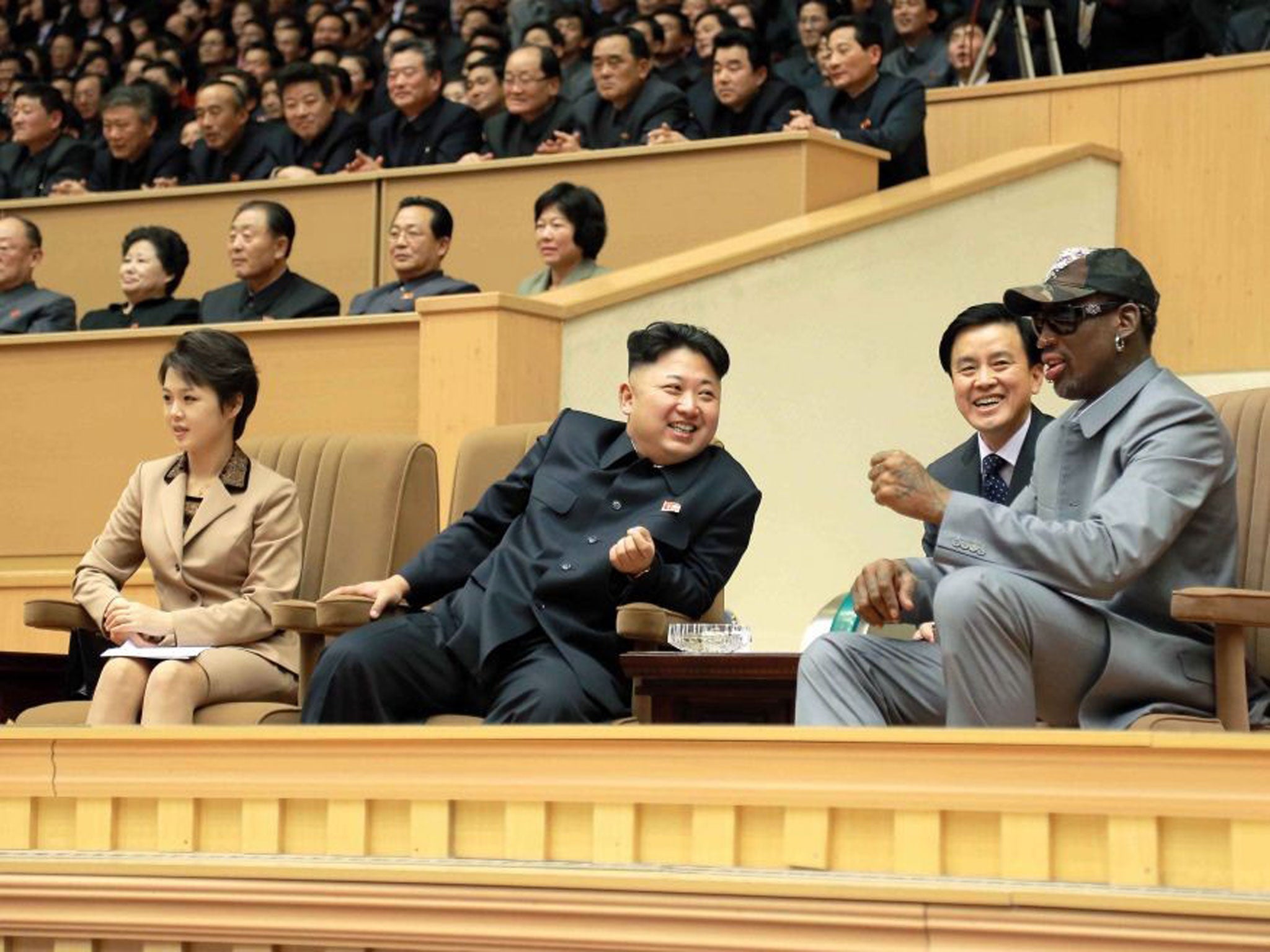 Kim Jong-un and former basketball star Dennis Rodman watch the friendly match between North Korea and an aging NBA 'All-stars' team