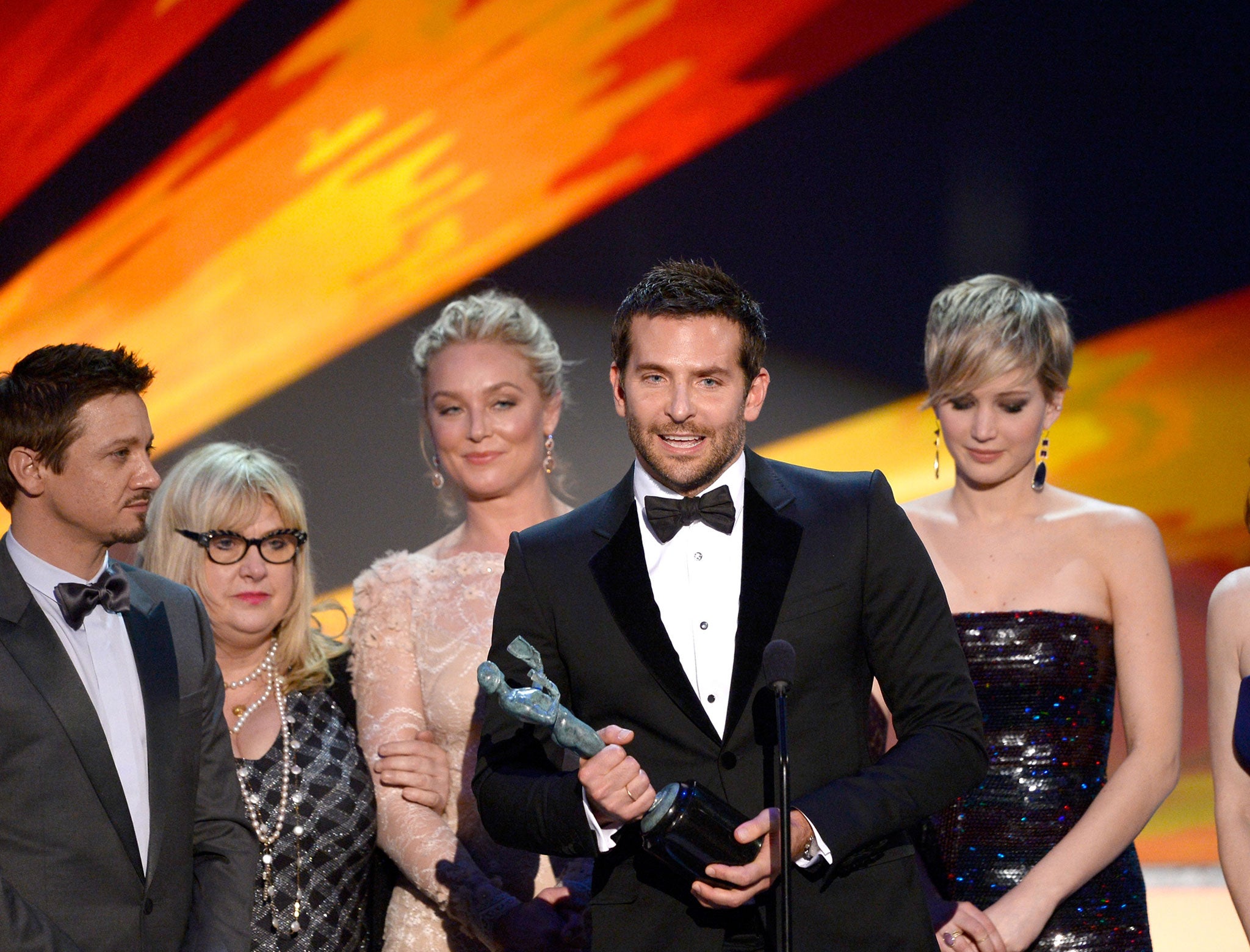 Jeremy Renner, Elisabeth Rohm, Bradley Cooper, Jennifer Lawrence and Amy Adams accept the Outstanding Performance by a Cast in a Motion Picture award for 'American Hustle' onstage during the 20th Annual Screen Actors Guild Awards
