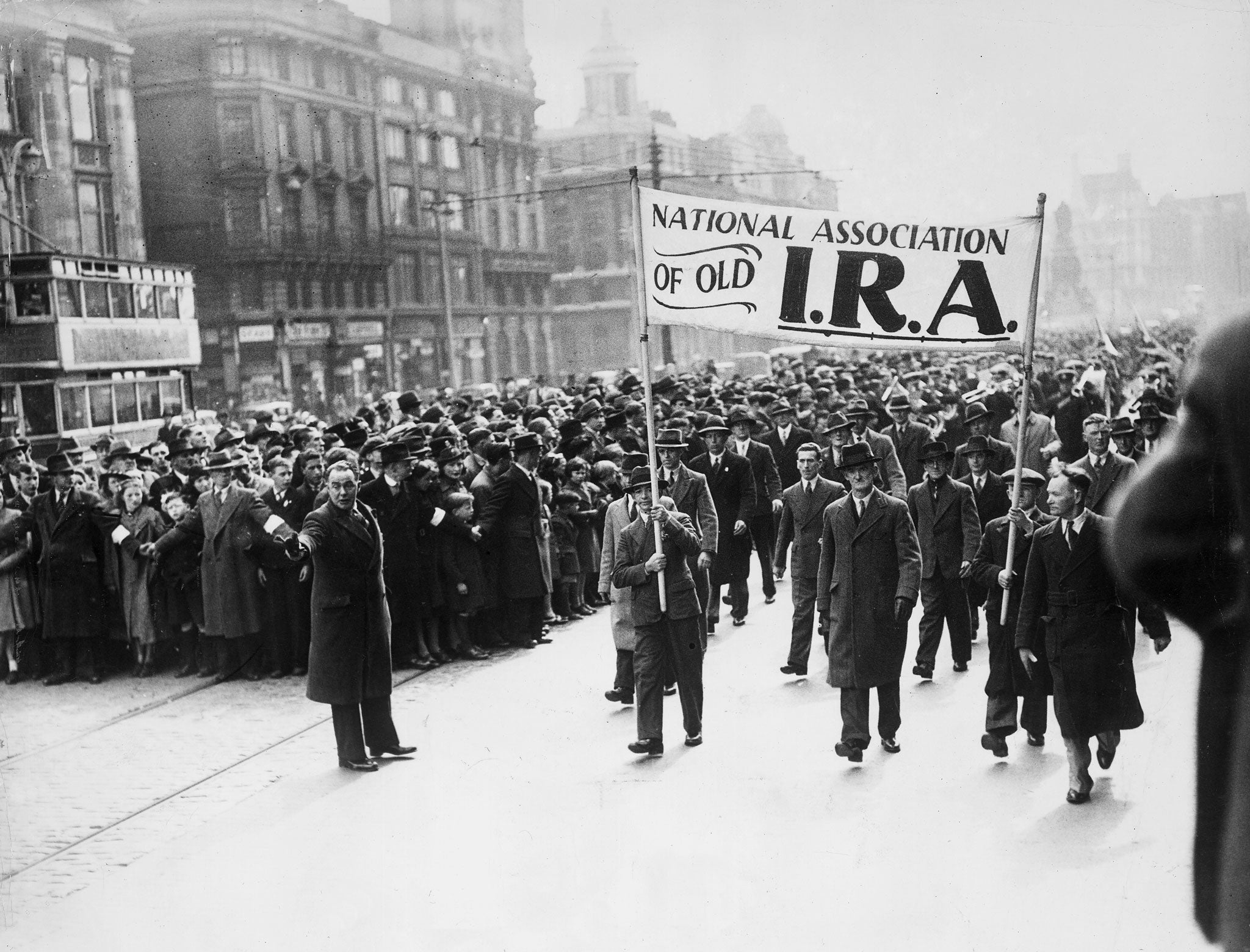 10th April 1939: Crowds march through the streets of Dublin to commerate the Easter Rising, the armed uprising of Irish nationalists against British rule in Ireland.