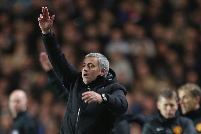 Jose Mourinho makes a gesture from the touchline during Chelsea's 3-1 win over Manchester United
