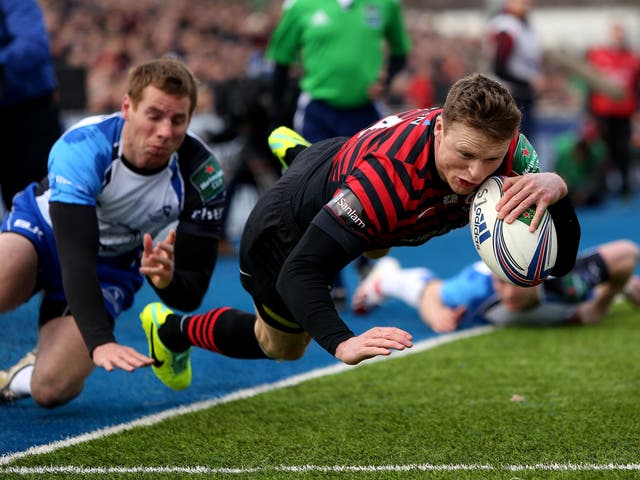 Saracens’ Chris Ashton evades the tackle of Gavin Duffy to score the opening try
