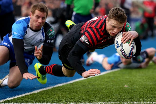 Saracens’ Chris Ashton evades the tackle of Gavin Duffy to score the opening try