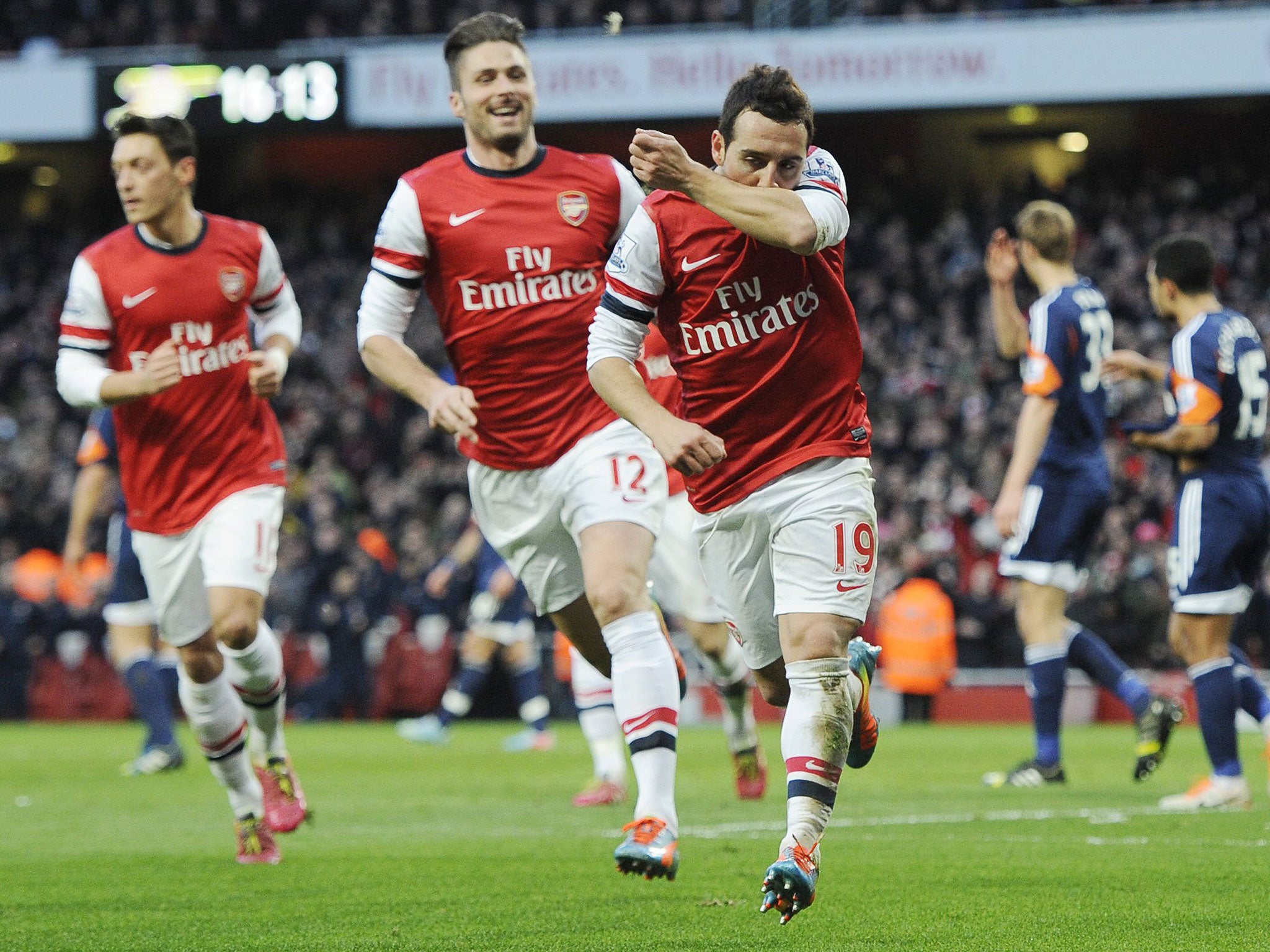 Santi Cazorla celebrates the first of his two goals for Arsenal against Fulham 