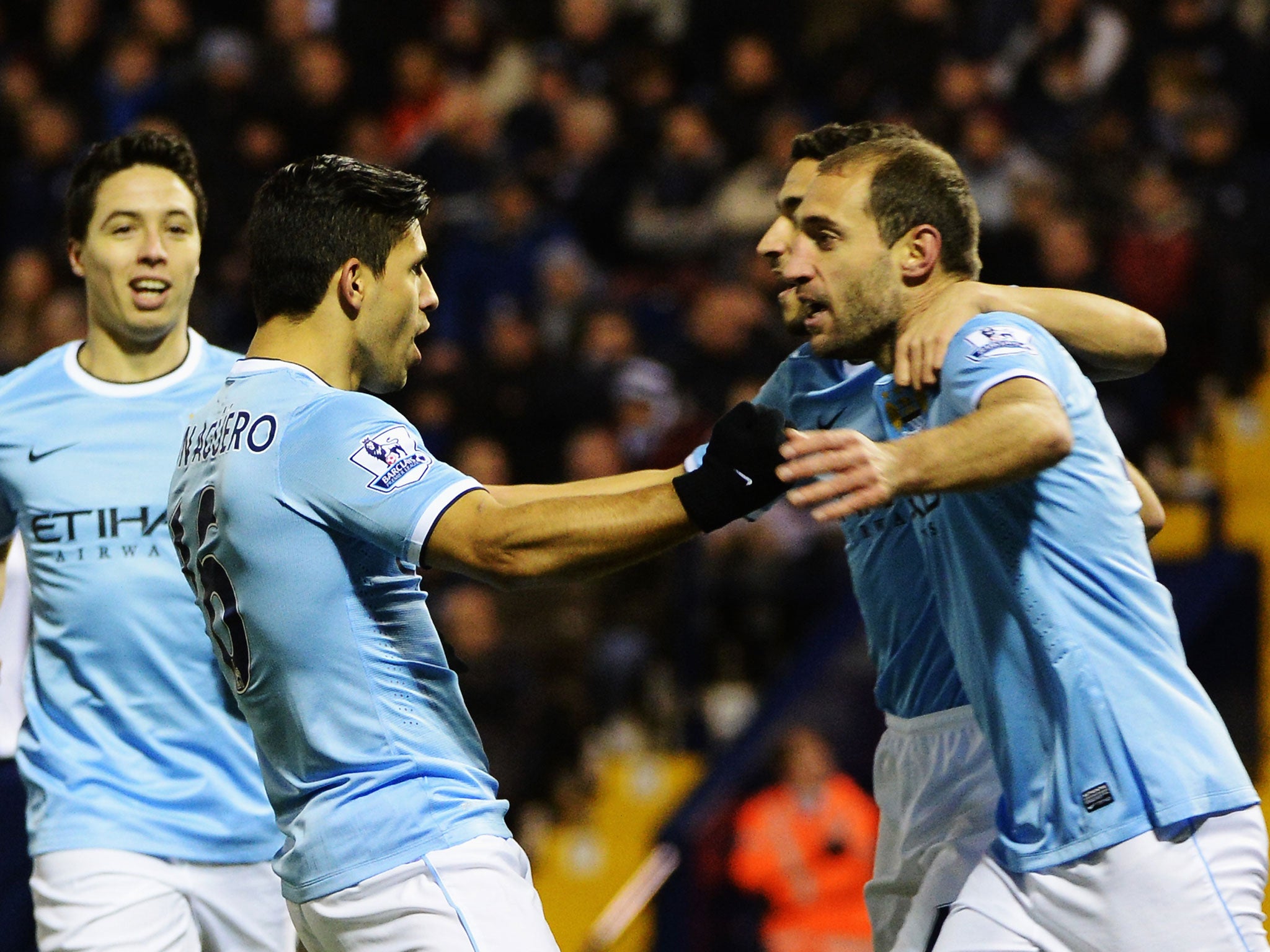 Sergio Aguero and Pablo Zabaleta celebrate after the striker scores for Manchester City