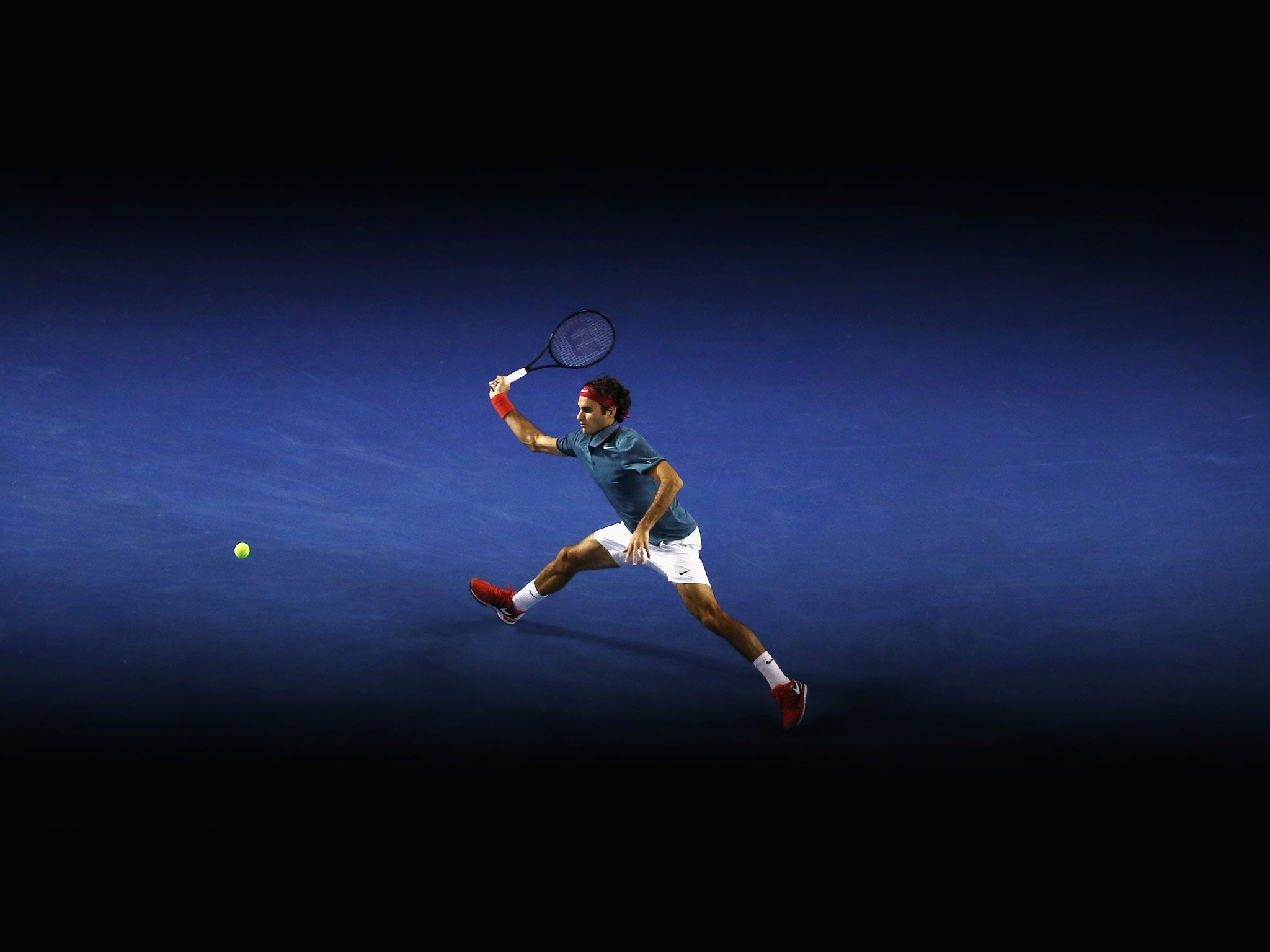 Roger Federer of Switzerland plays a forehand in his fourth round win against Jo-Wilfried Tsonga