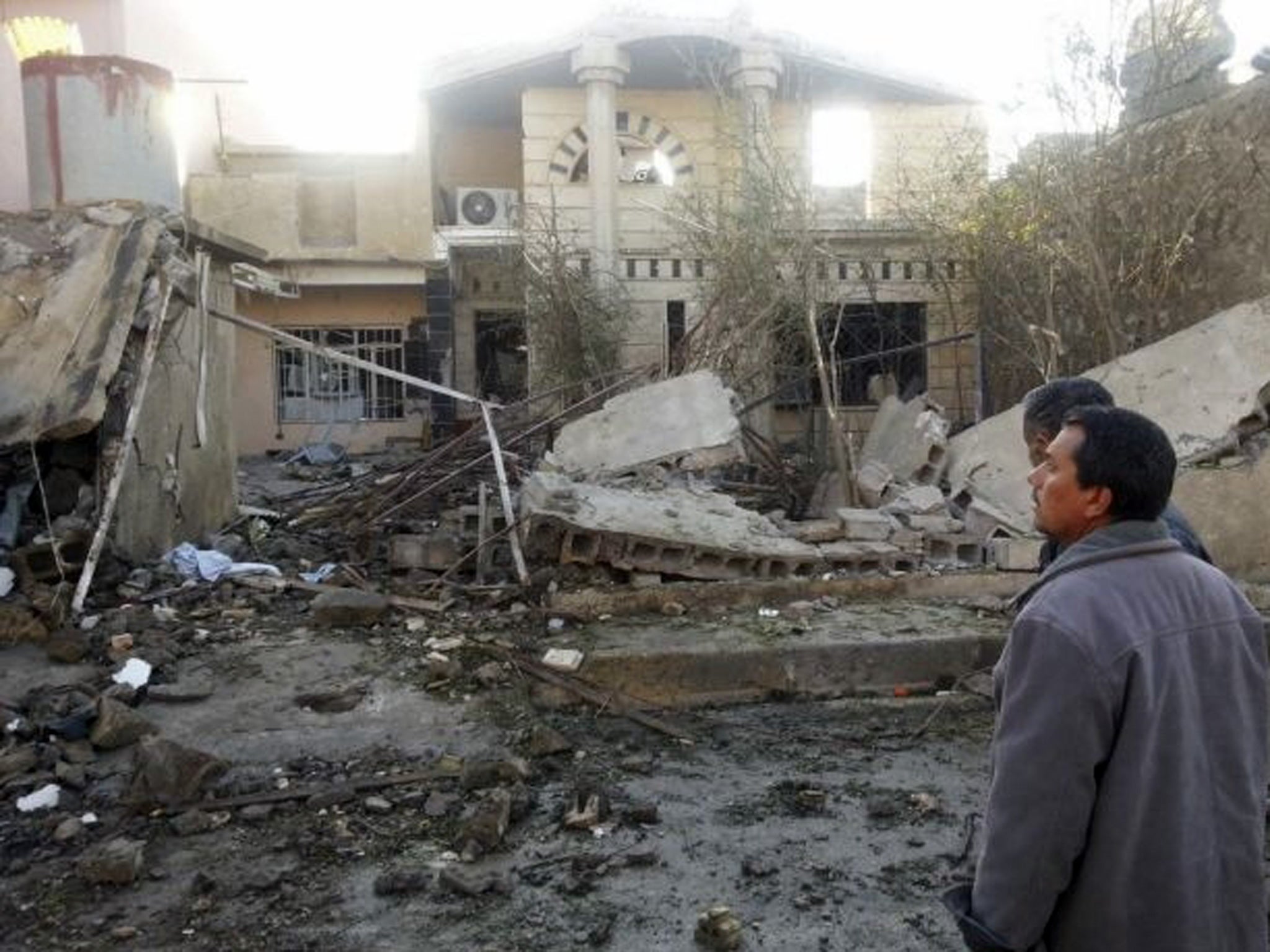 Civilians at the site of a car bomb attack in the town of Tuz Khurmatu, north of Baghdad
