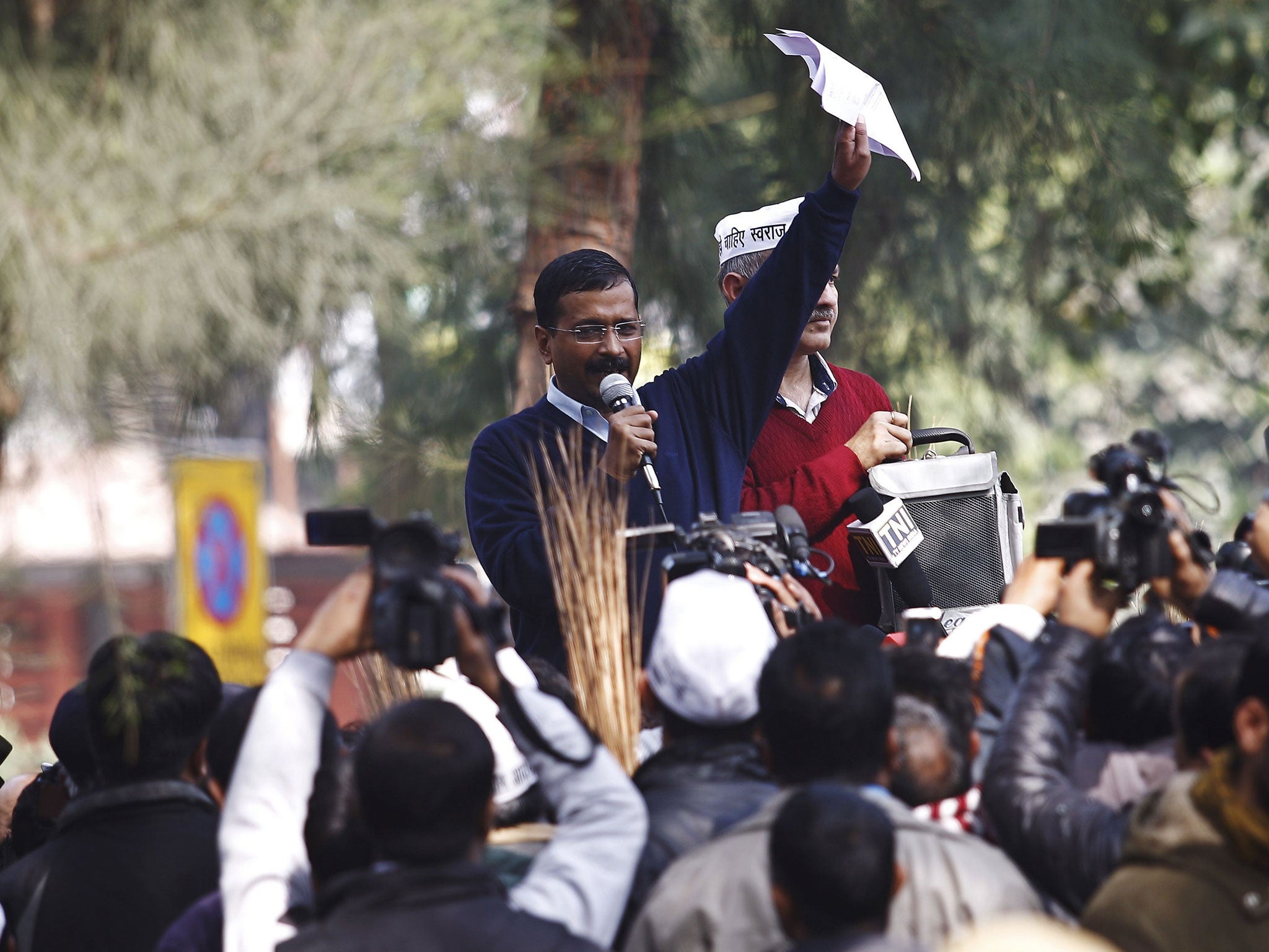 Delhi's Chief Minister Arvind Kejriwal addresses his supporters during a protest in New Delhi
