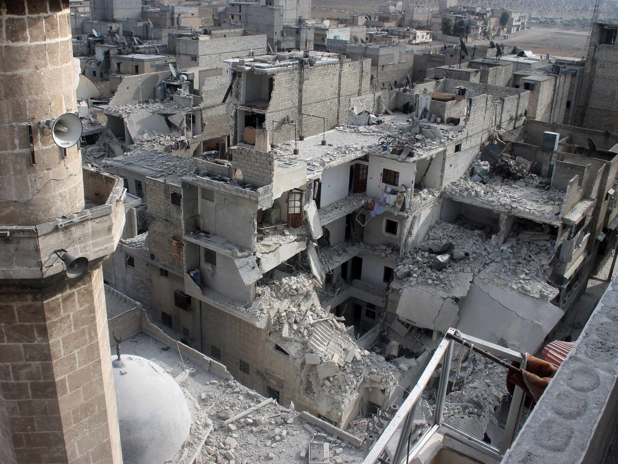 Buildings in Aleppo that fell down following reported air raids by government warplanes (AFP/Getty)