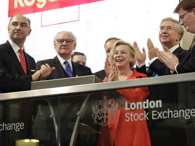 Moya Greene in red at the London Stock Exchange in October 2013; Moya Greene's £1.5m earnings were modest compared  to those of other FTSE 100 bosses