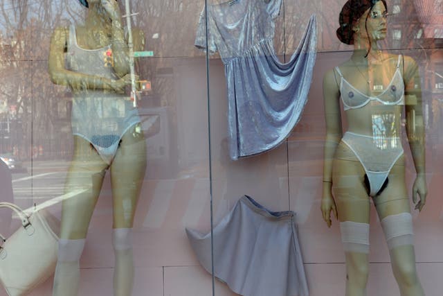 Mannequins with pubic hair are displayed in the window of an American Apparel shop on Houston Street in the Soho section of Manhattan January 17, 2014 in New York. 