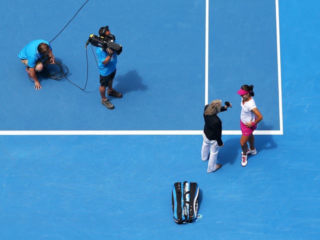 Na Li of China is interview on court after winning her quarterfinal match against Flavia Pennetta