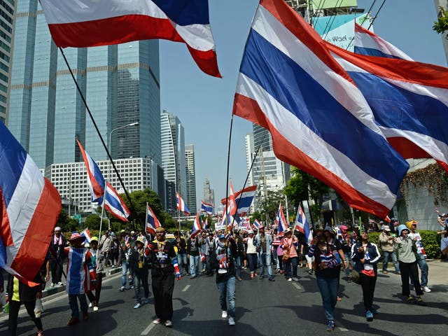 Thai anti-government protesters march as part of their ongoing rallies in downtown Bangkok