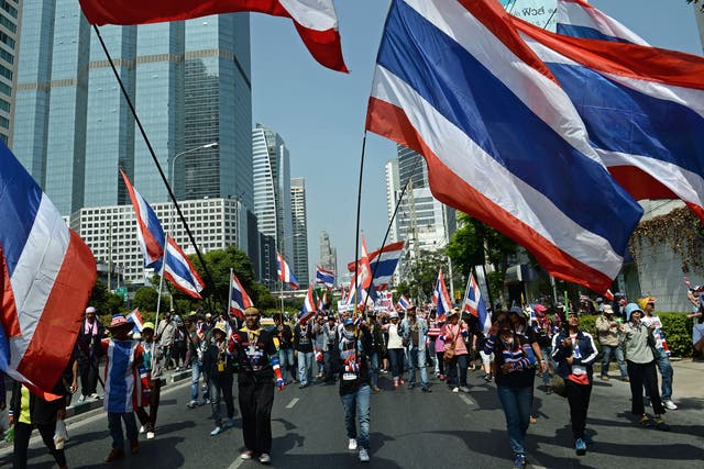 Thai anti-government protesters march as part of their ongoing rallies in downtown Bangkok