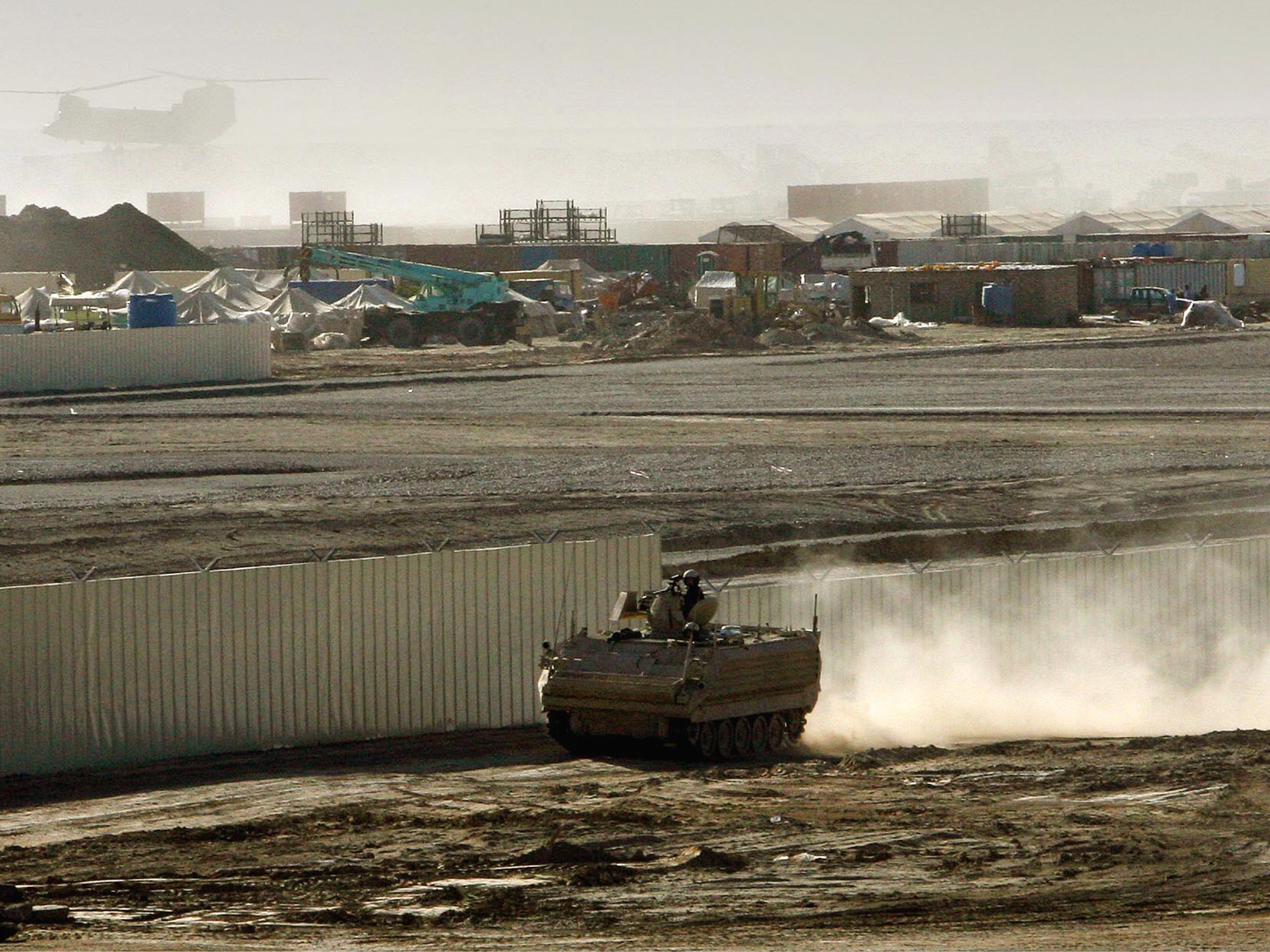 A British armored vehicle patrols on the periphery of the camp Bastion in southern Afghanistan in 2007