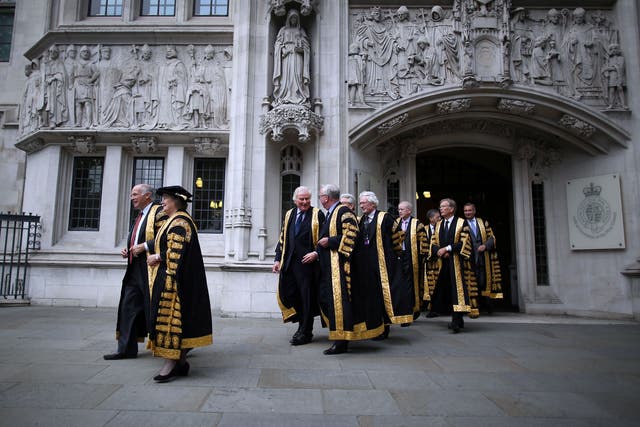 Supreme Court Justices leave the Supreme Court to in London, where a ruling against HS2 objectors was made on Wednesday