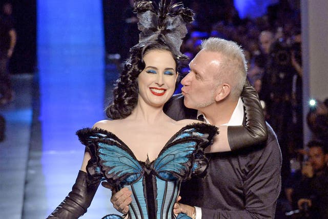 Model and burlesque dancer Dita Von Teese gets a kiss from Jean-Paul Gaultier