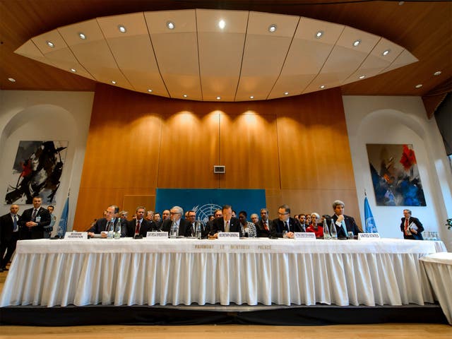 The UN Secretary-General Ban Ki-Moon (centre) welcomes delegates hoping to bring an end to Syria’s civil war to the Montreux Palace Hotel in Switzerland