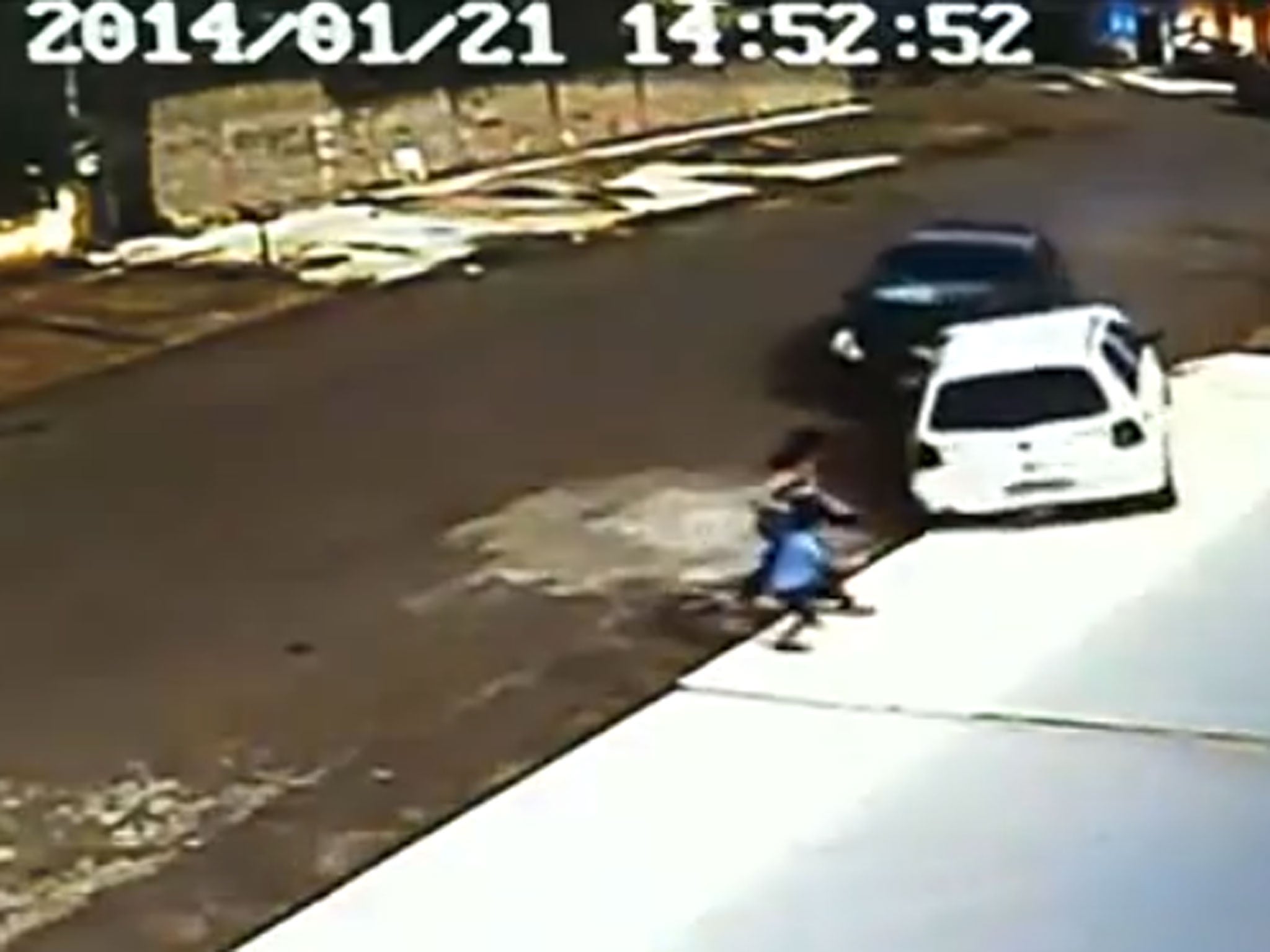 Footage posted online showed the extraordinary moment this woman and child were mown down by an out-of-control car - and jumped straight back up