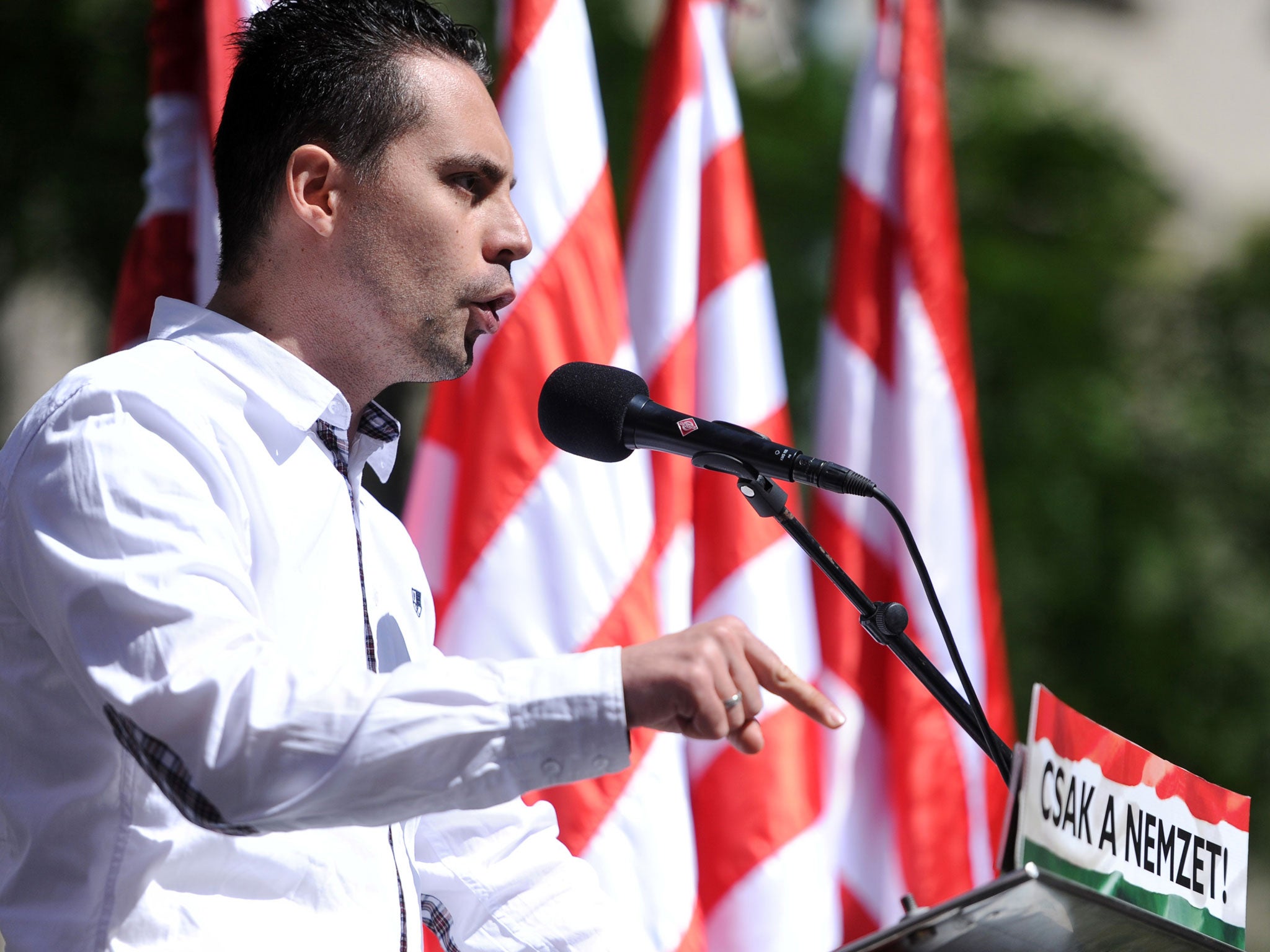 Gabor Vona delivers a speech during a demonstration of the nationalist party in Budapest. Campaign groups want to see Home Secretary Theresa May enforce a ban on Mr Vona entering the UK.