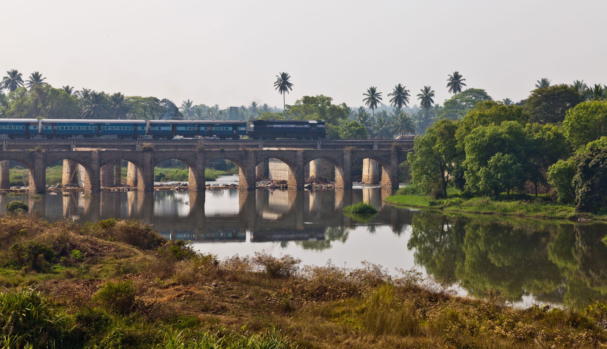Rumbling on: A train crosses a bridge in Karnataka