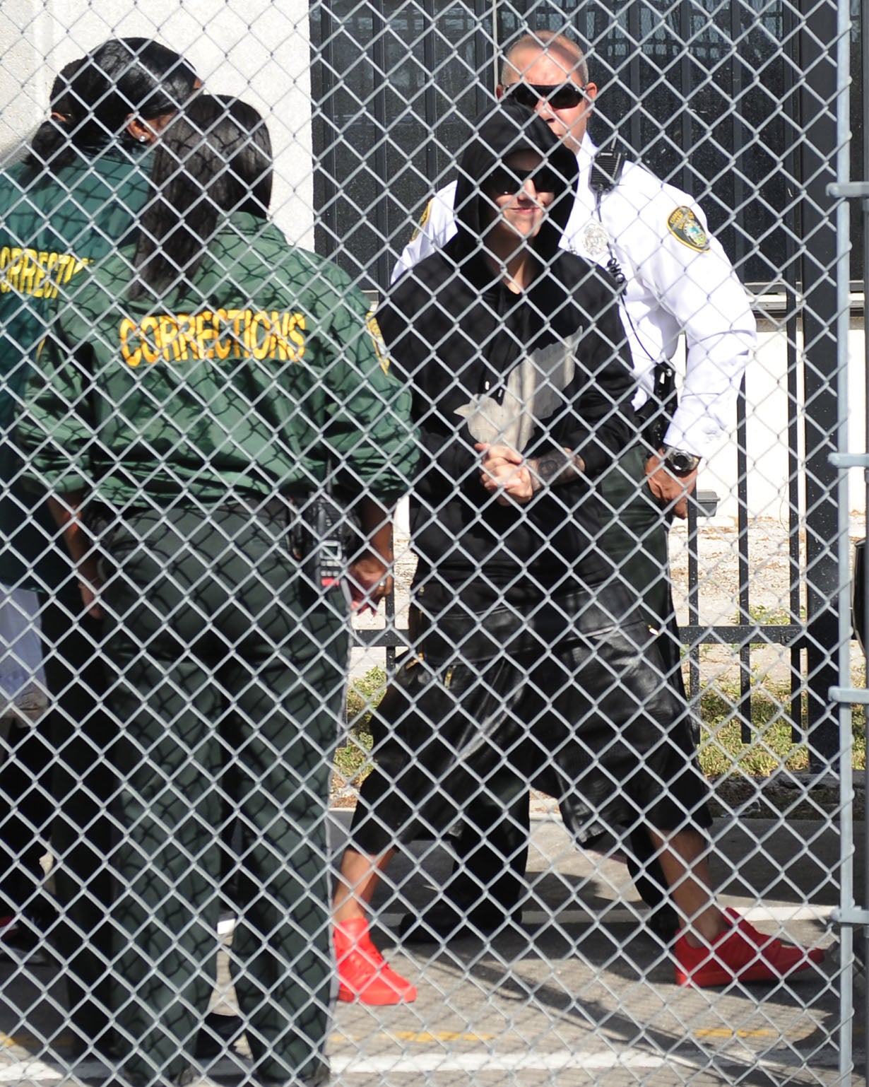 Justin Bieber was accused of arrogance after he put on a display for fans, smiling and stopping to wave as he left the prison after posting bail