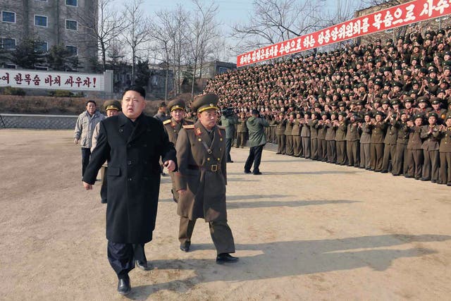 North Korean leader Kim Jong-Un (left) inspects the command of Korean People's Army. The country's Defence Commission has sent an open letter to South Korea calling for an end to "hostile military tactics"