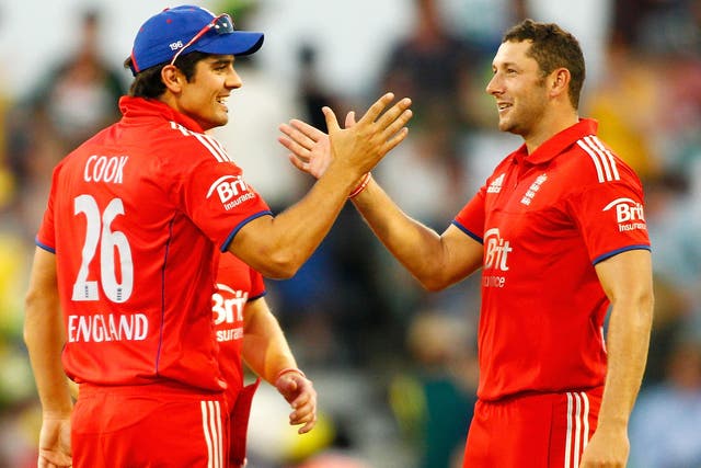 Alastair Cook and Tim Bresnan of England celebrate after defeating Australia during game four of the One Day International series between Australia and England