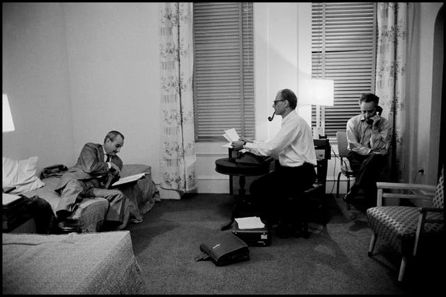 Robert Whitehead, Arthur Miller and Elia Kazan working on the production of the play 'After the Fall' in the Chelsea Hotel, 1963