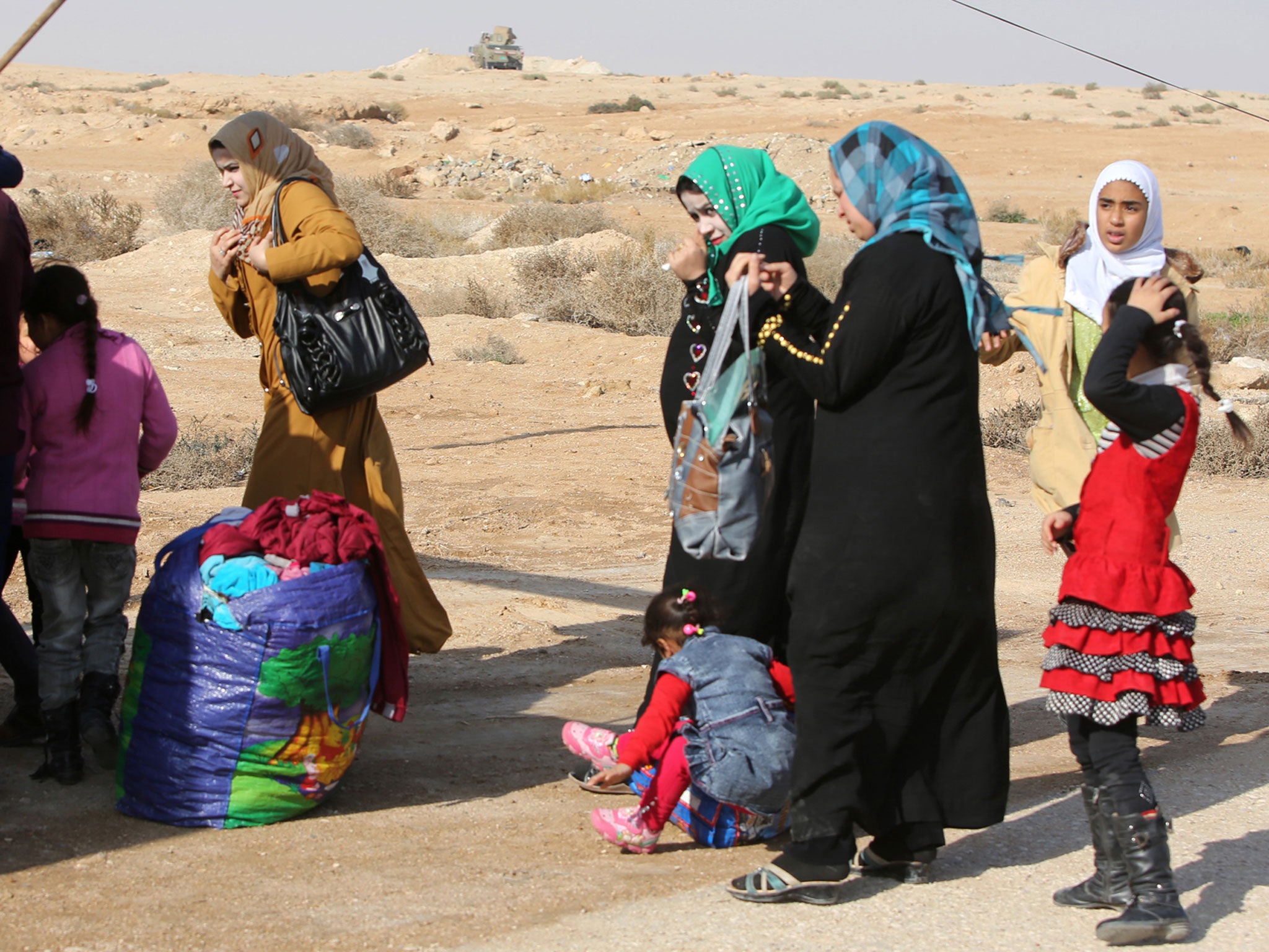 Iraqi women and children flee Anbar in early January, as part of the 140,000 who have left the province