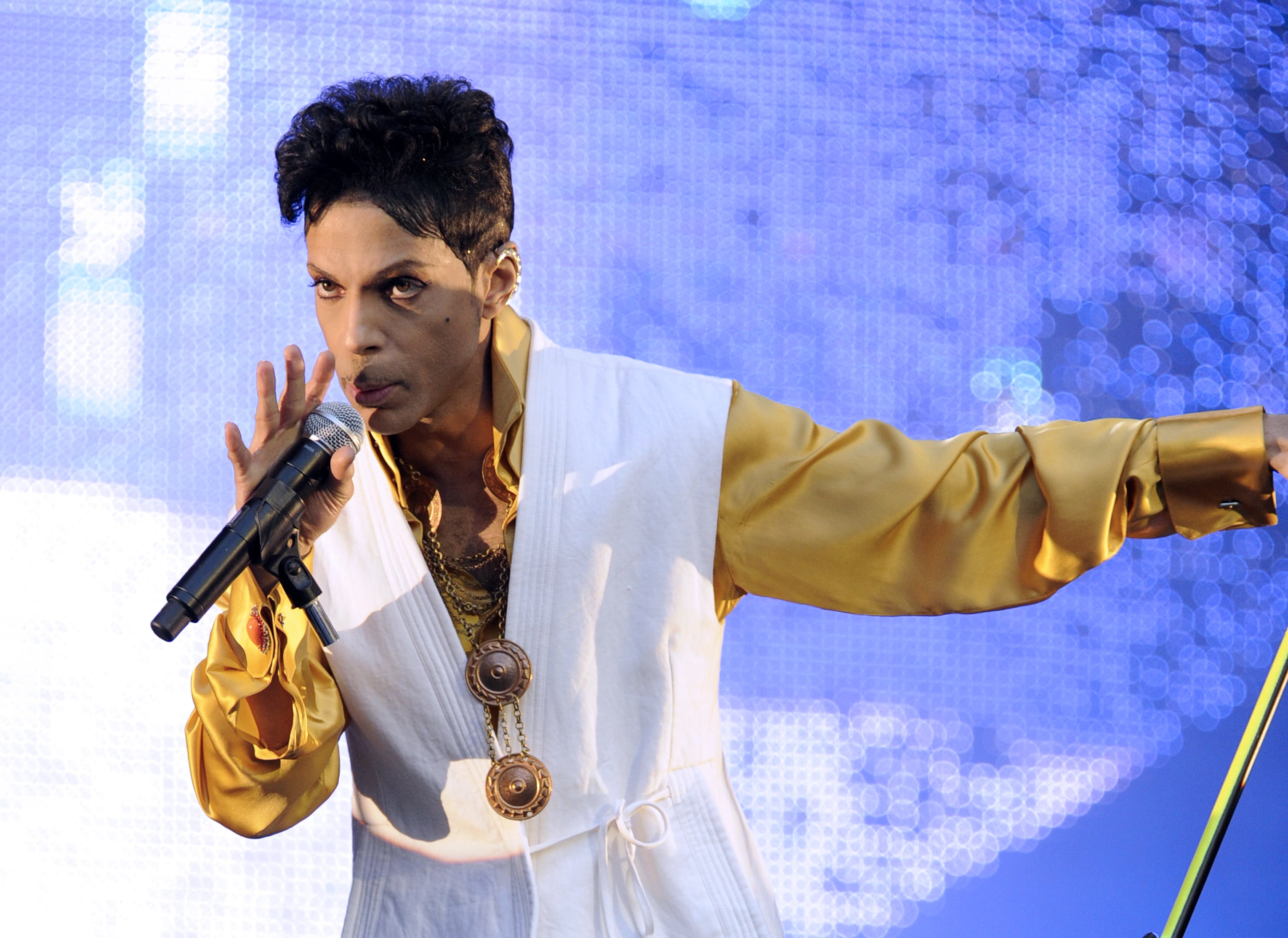 Prince performs on stage at the Stade de France in Paris